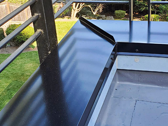 PVC membrane roofing with metal edge and railing