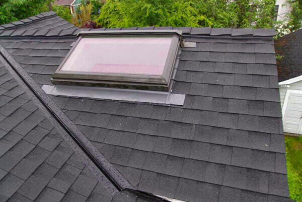 Skylight and Composition shingle roofing project from Larry Haight Residential Roofing