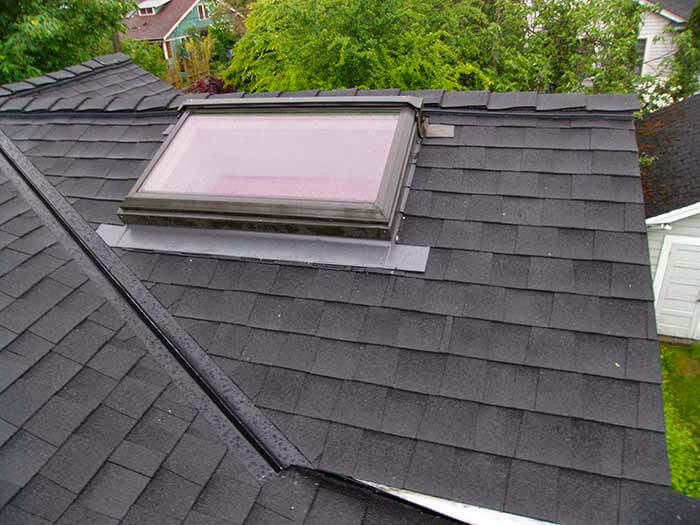 Skylight and Composition shingle roofing project from Larry Haight Residential Roofing