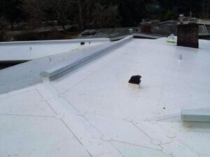 leaky roof made of PVC membrane that is in need of repairs