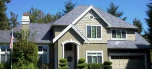 Beautiful home with dark green siding and a new roof after learning how much it cost in Issaquah and surrounding Seattle areas