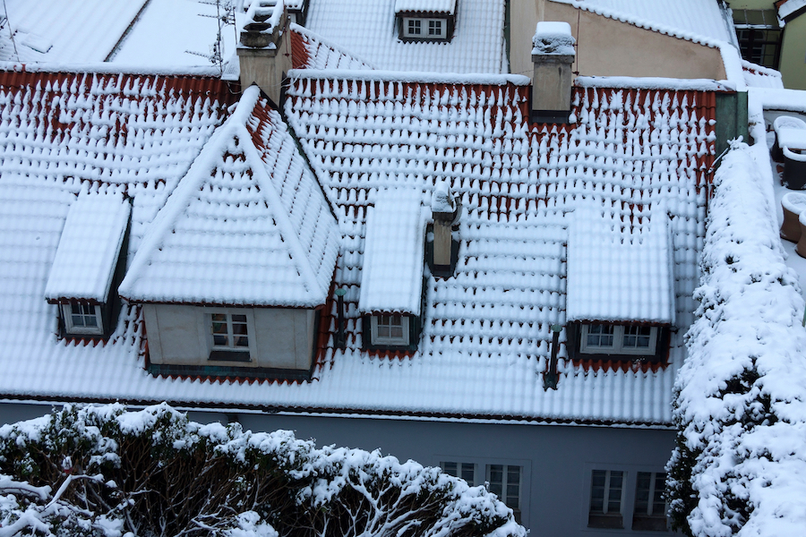 The Look On The Snowy Roofs Of The Old Gothic Town Prague 